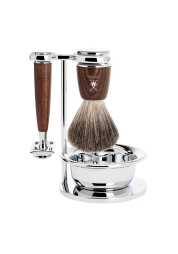 Experience the pinnacle of German precision with the Rytmo Set 4 Steamed Ash Pure Badger shaving kit. This elegant set, complete with a reliable shaver, badger bristle brush, soap bowl, and stylish stand, offers a premium, high-quality wet shaving experience. It's more than just a shaving tool, it's a design piece that elevates your bathroom decor, making it the perfect gift for wet shaving enthusiasts.