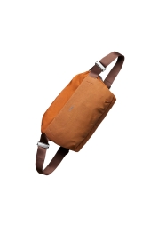 Embark on an all-day adventure with the Venture Sling 9L Bronze, Bellroy 's largest shoulder bag. Featuring an easy-access two-way zipper, spacious compartments, and 100% recycled waterproof fabric, this bag is perfect for storing your everyday essentials, offering superior comfort, organization, and sustainable style.