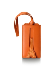 Create your own travel style with our Emily in Paris orange leather luggage tag. This accessory stands out with its Parisian flair and practicality, highlighted by a retractable name tag and secure strap. The Emily in Paris leather luggage tag is not only a functional element, but also a statement of your style and desire to travel.